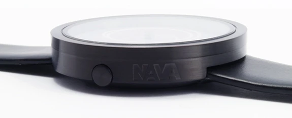 The black leather strap and stainless steel case offer a minimalist housing for the unique face
