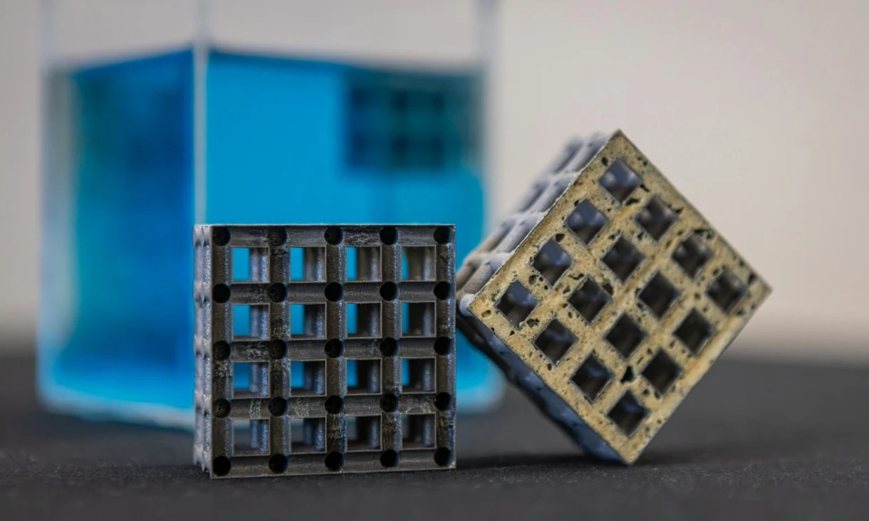 Cross sections of the titanium lattice cube showing before and after being filled with polyurethane foam for buoyancy