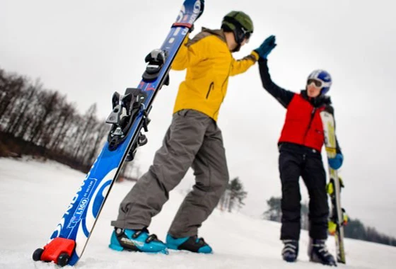SkiCart is a device that allows downhill skiers to pull their skis behind them instead of having to carry them