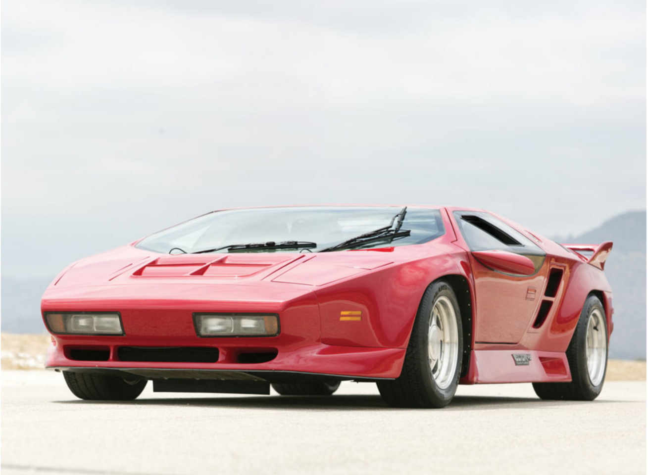 The Vector W8 was an American supercar produced from 1990 to 1993 utilizing aerospace materials. Just 19 W8s were produced and sold new for $448,000, an astonishing amount for the time. The cars featured an epoxy-bonded and riveted aluminum semi-monocoque chassis with an aluminum honeycomb floor pan, and the Rodeck Aluminum 365 cu. in. racing engine used twin intercooled turbochargers to produce 625 hp. The turbo boost levels were driver adjustable between 8 and 14 psi and the W8 had a claimed top speed of 242 mph (389 km/h).