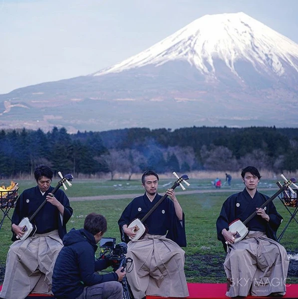 20 drones equipped with a total of 16,500 LED lights hovered in formation while flickering in time to the strumming of Shamisens