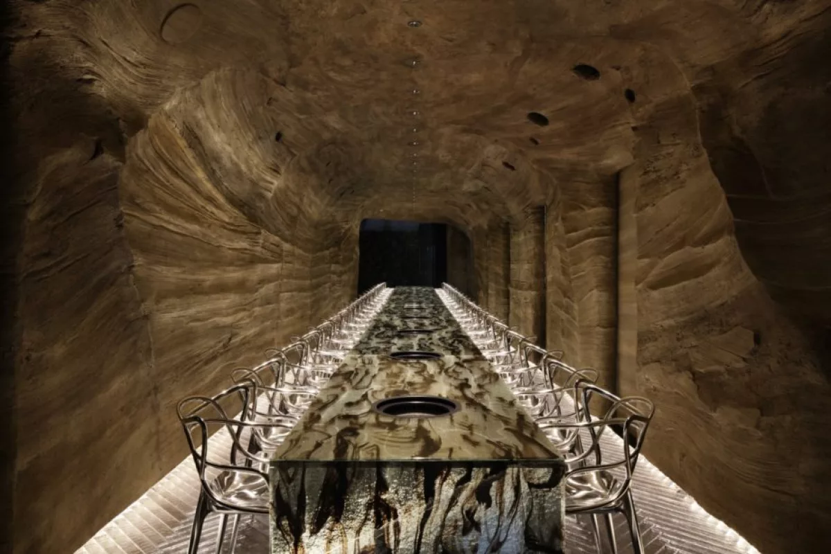 A nominee for Best Craftsmanship and Best Use of Material, this Japanese restaurant called Nikunotoriko consists of two floors: one resembles a cave with a bespoke long glass table, and the other floor is designed to be a hillside environment with laser-cut contoured floors