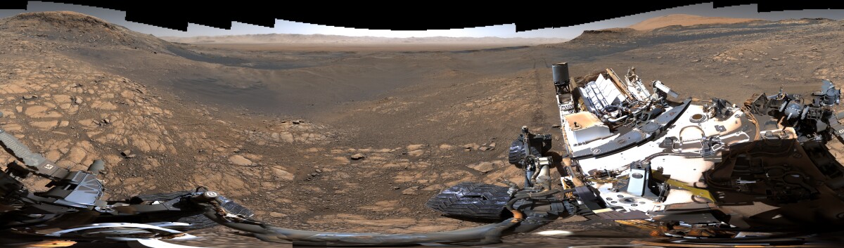 Curiosity used its medium-angle lens to build a lower-resolution panorama of almost 650 million pixels, capturing its deck and robotic arm