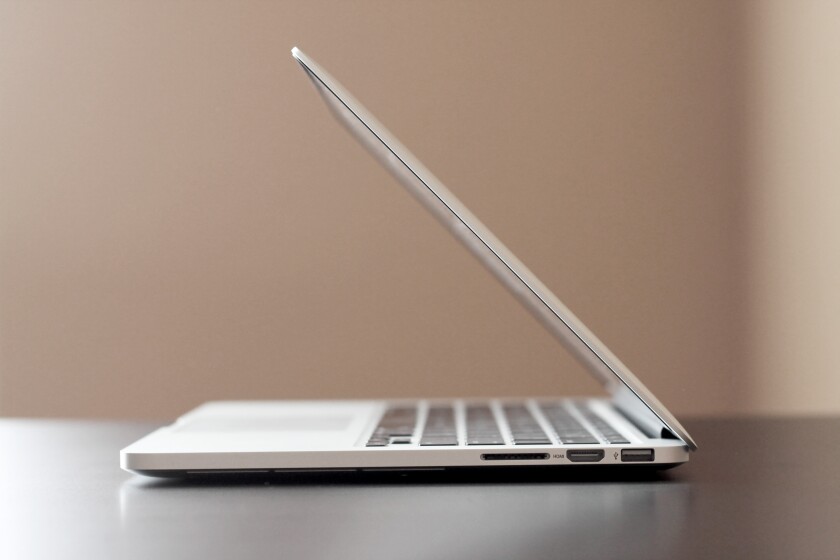 It isn't as thin as the MacBook Air, but the newest rMBP is slightly thinner than its predecessor