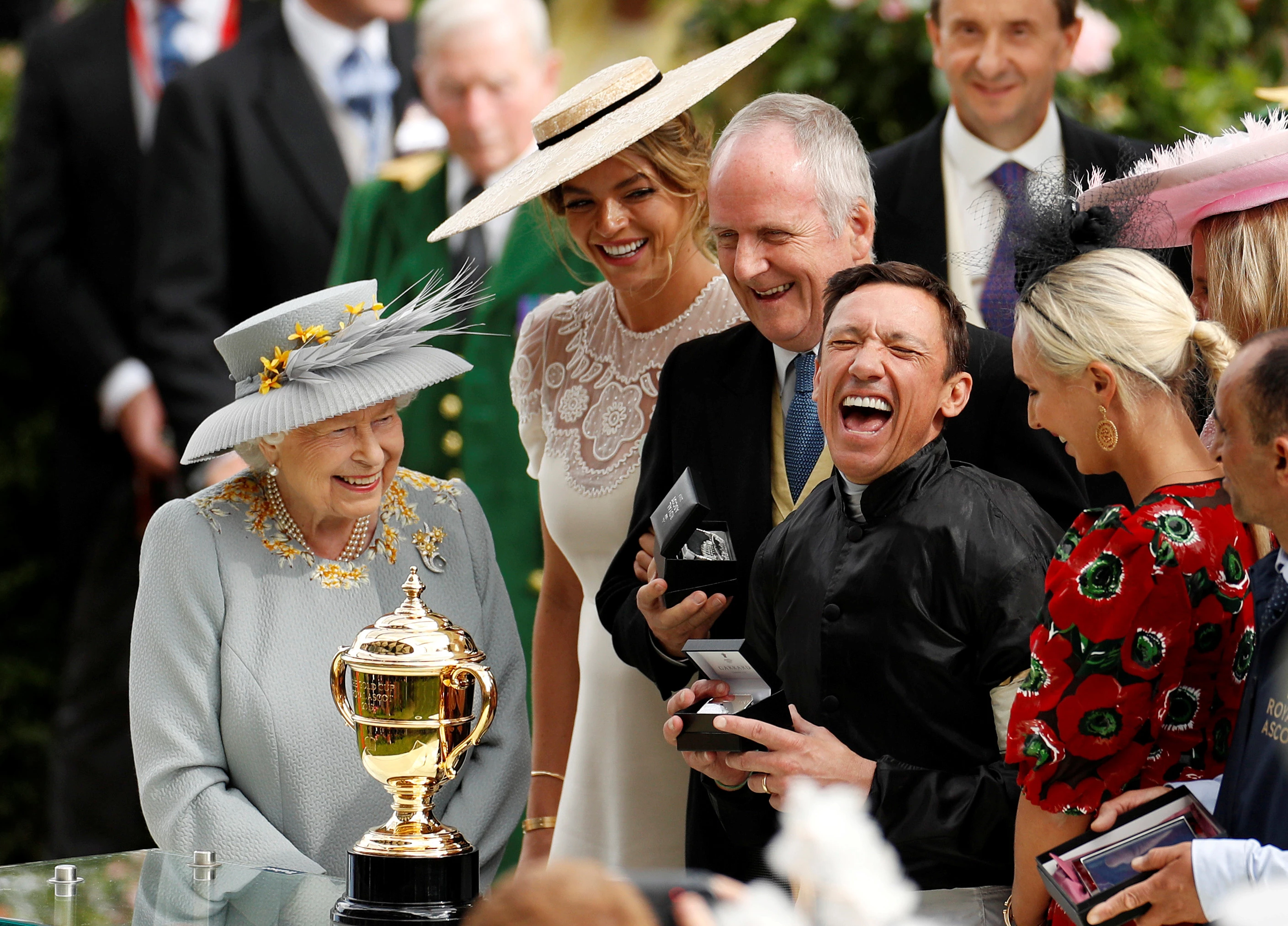 Silver, Joy. Frankie Dettori celebrates with the trophy after winning the 4.20 Gold Cup on Stradivarius as Britain's Queen Elizabeth looks on