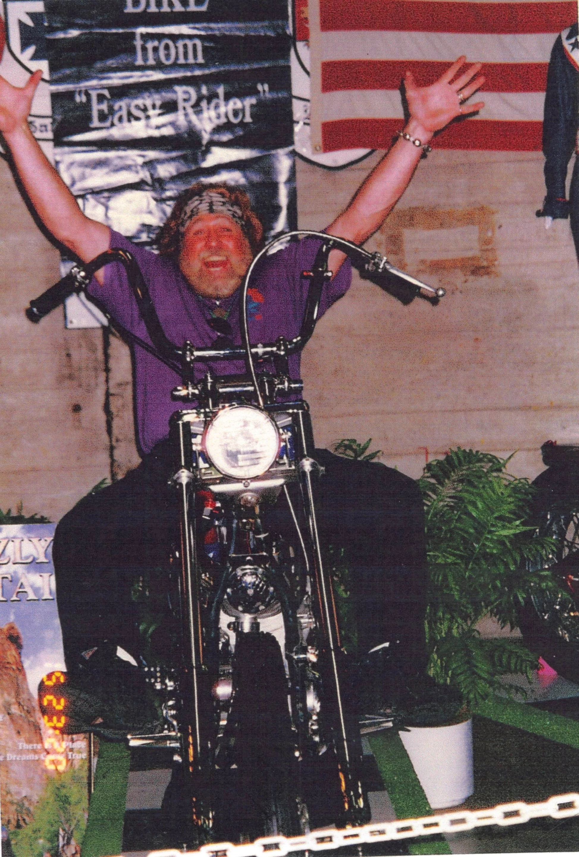 Dan Haggerty on the Captain America Harley-Davidson Panhead Chopper from the Gordon Granger Collection. This image was taken in the lead up to the 1996 auction of the machine by Dan Kruse Classics when the machine was sold by celebrity vehicle collector, Gary Graham, to Gordon Granger.