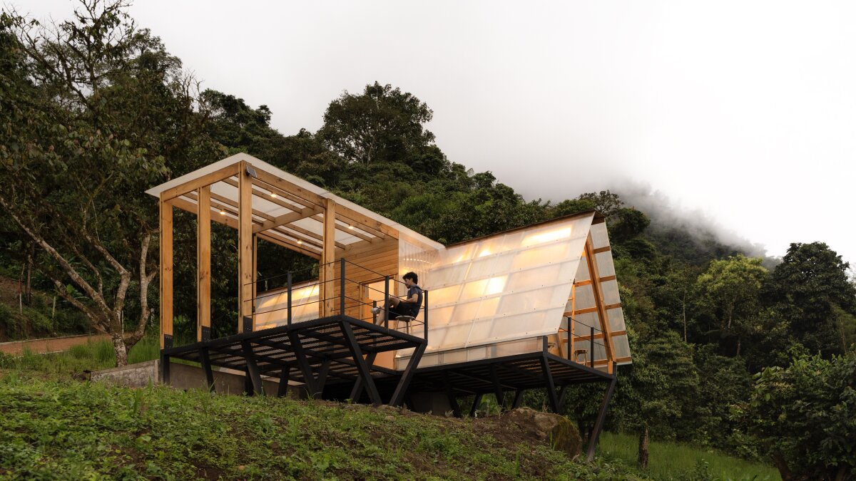 Tiny triangular cabin perches off a slope in Ecuador's cloud forest