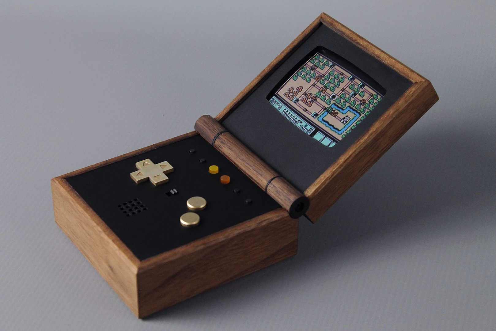 The Pixel Vision: A Game Boy replica fitted into a wooden box that can flip open