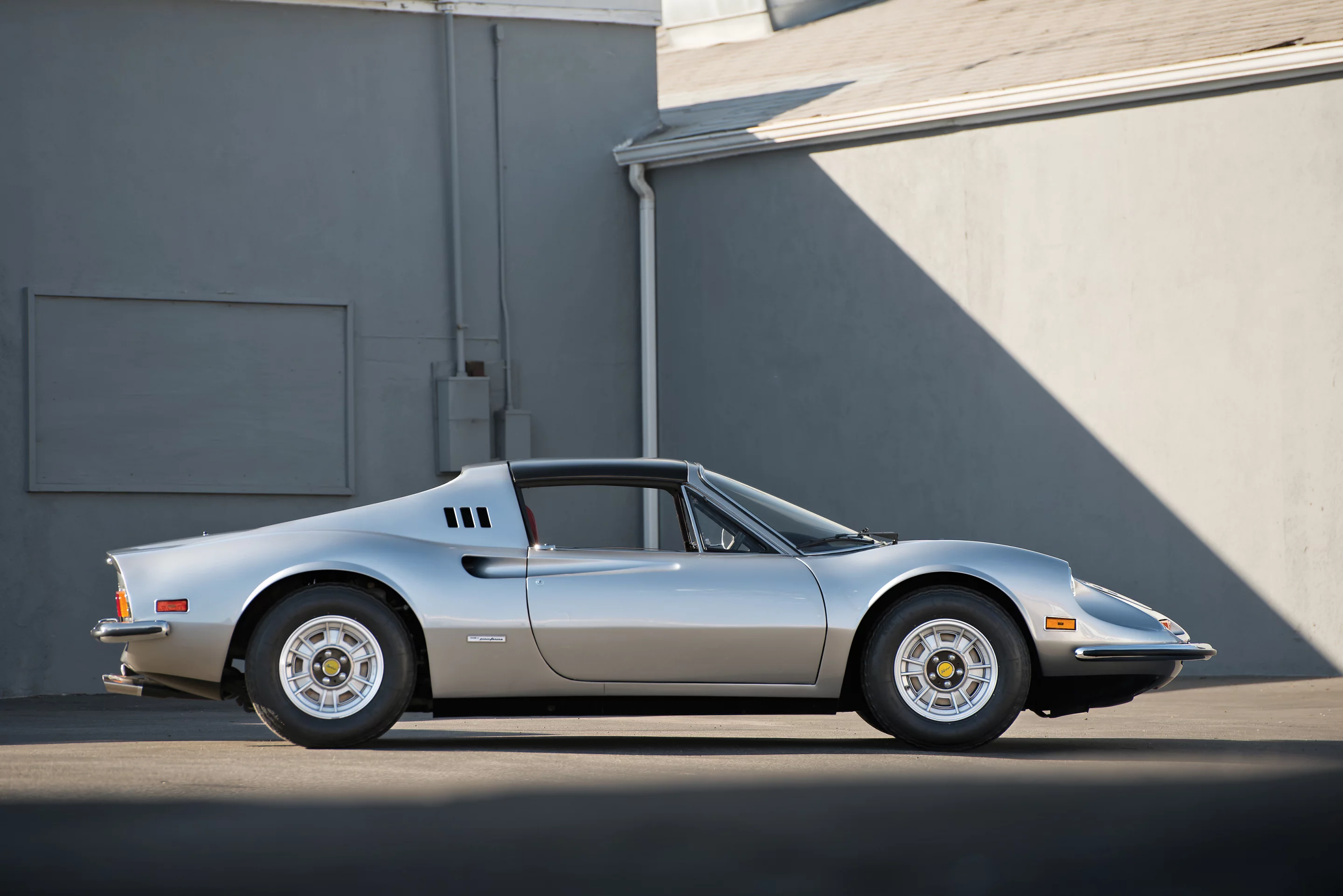 This particular 1974 Ferrari Dino 246 GTS was fitted with air conditioning and power windows and has since been upholstered with factory Daytona seats