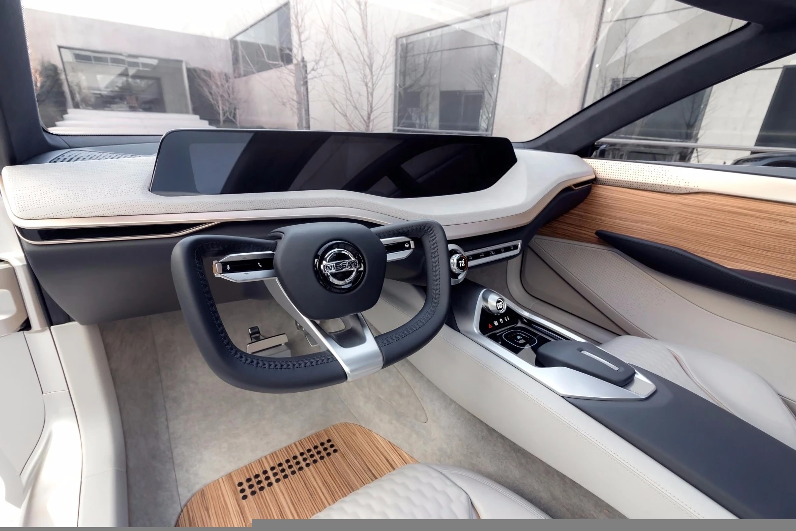 The minimalist design of the Vmotion 2.0's interior showcases a large dash screen that runs nearly the full length of the uplifted dashboard
