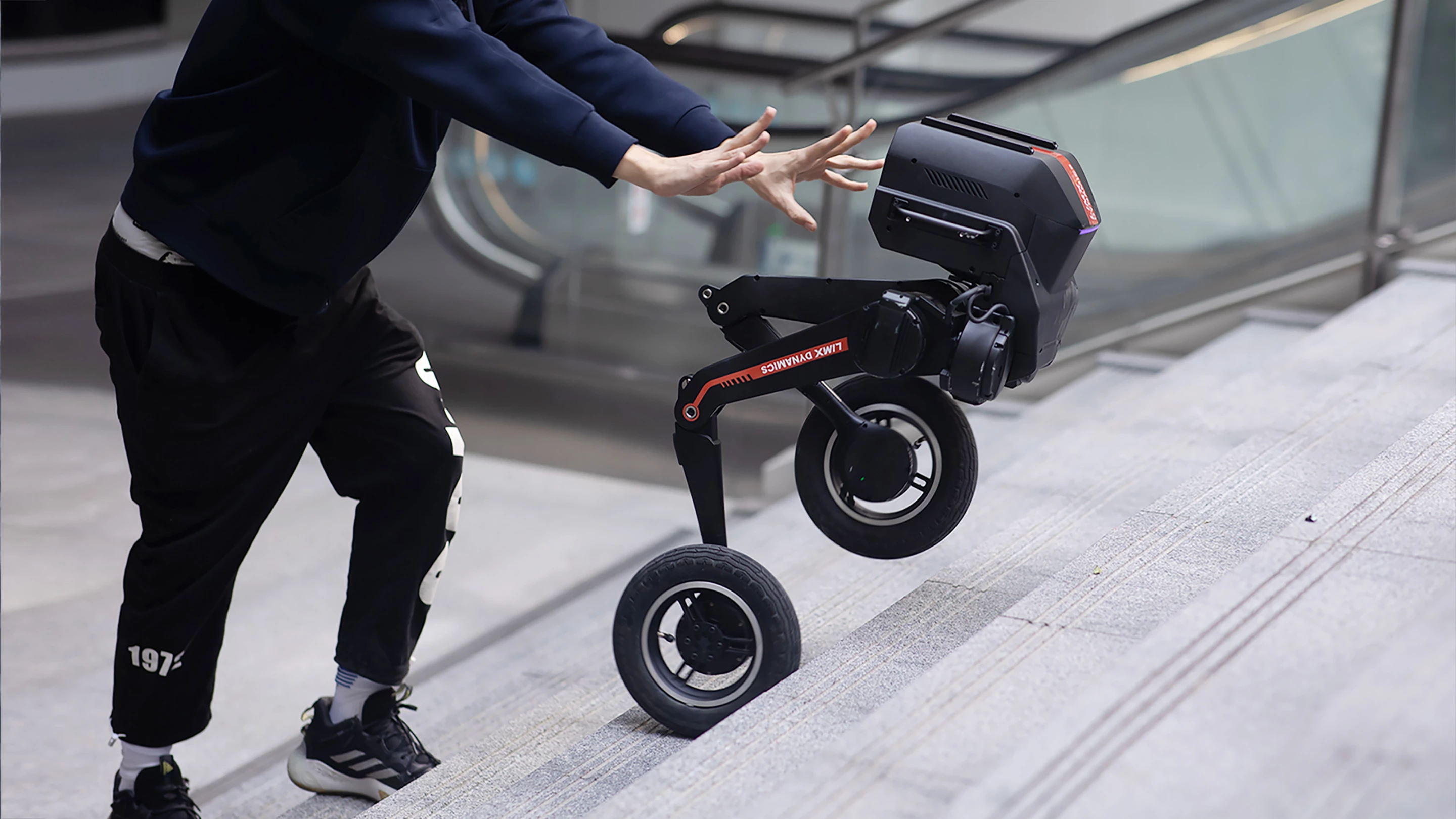 The Tron 1 getting pushed around to demonstrate its self-righting abilities