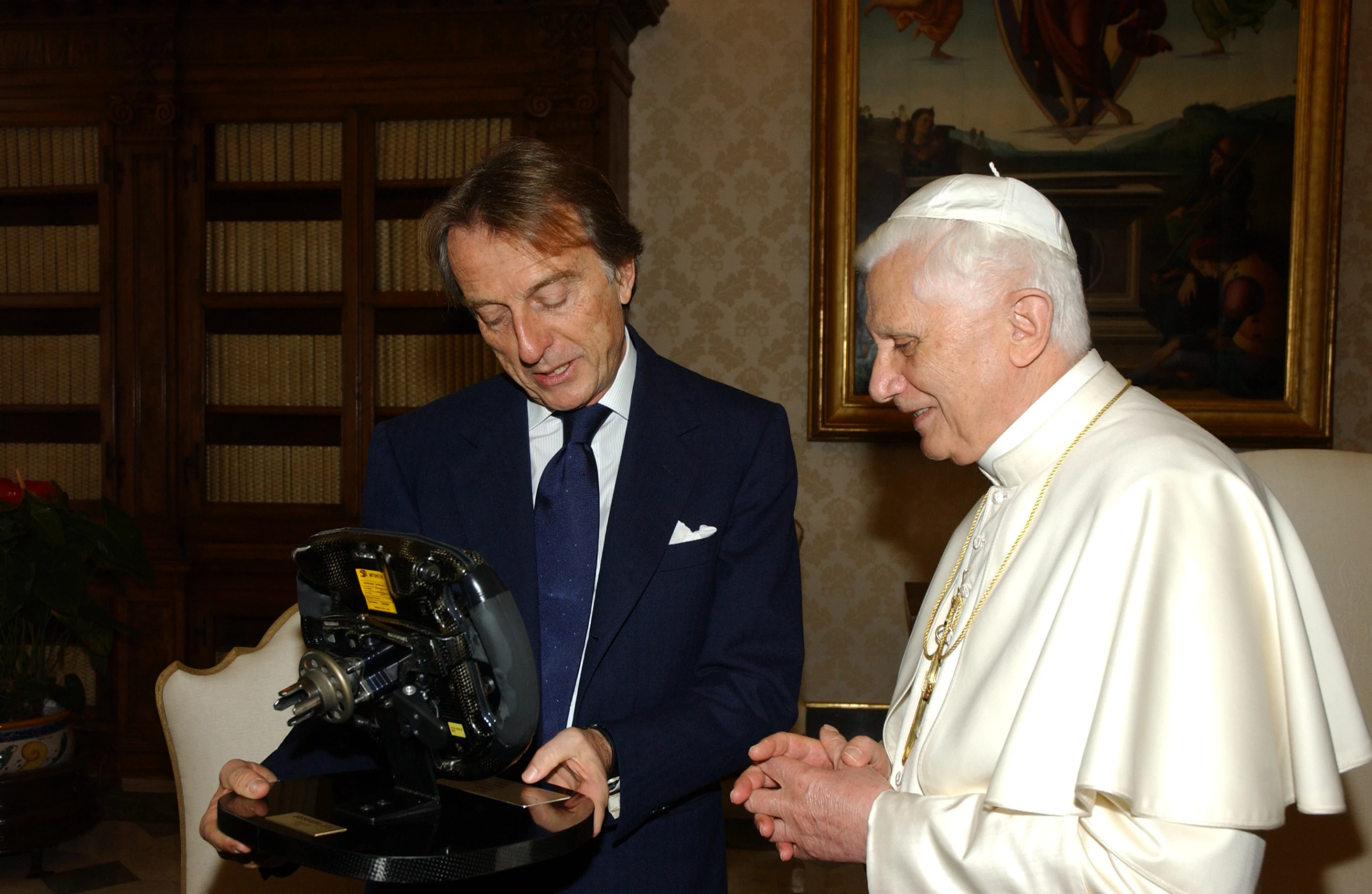 On 5 December 2005, his holiness Pope Benedict XVI received the President of Ferrari, Luca di Montezemolo, in a private audience, accompanied by Vice President Piero Ferrari and a small delegation of company representatives. During the meeting, President Montezemolo presented the Holy Father with a check for €950,000 obtained from the sale of the 400th Ferrari Enzo. His Holiness particularly appreciated the gift of the steering wheel of Schumacher's F2004 with the inscription: "The steering wheel of the Formula 1 World Champion to His Holiness Benedict XVI, a driver of Christianity."