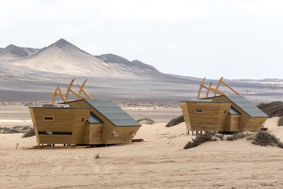 Inside the cabins at Namibia's Shipwreck Lodge, guests find a wood burner stove and an ensuite