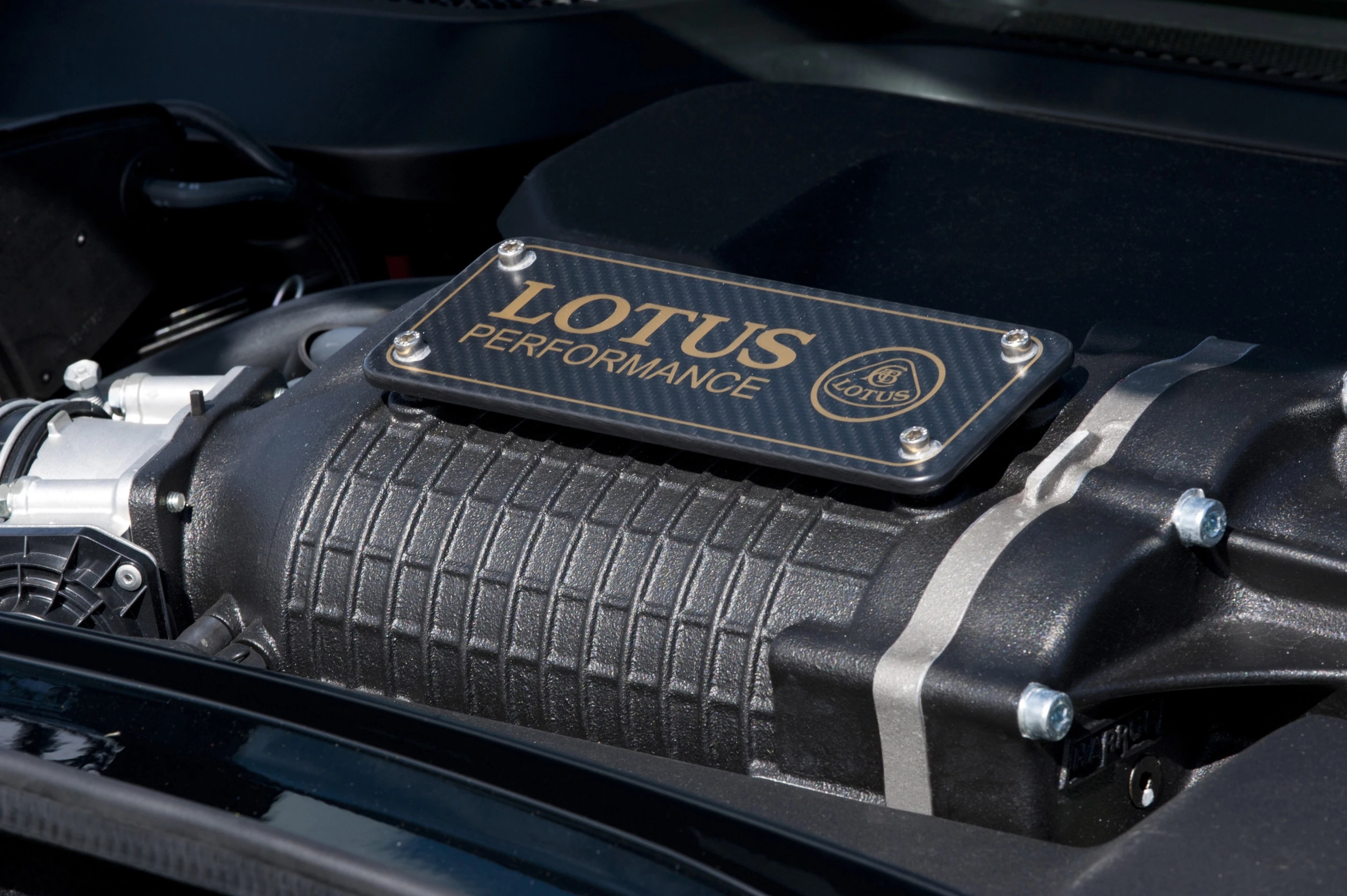 The supercharged 3.5-liter V6 includes a carbon fiber plaque