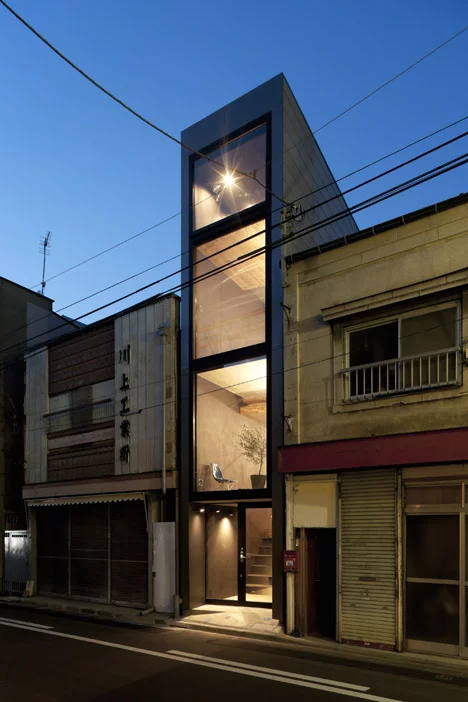 Another innovative Japanese design slipping a house in an alleyway between two existing buildings. The livable width of the house is just 70 in (1.8 mt) with the four floor structure opening up at different points to filter natural light from top to bottom