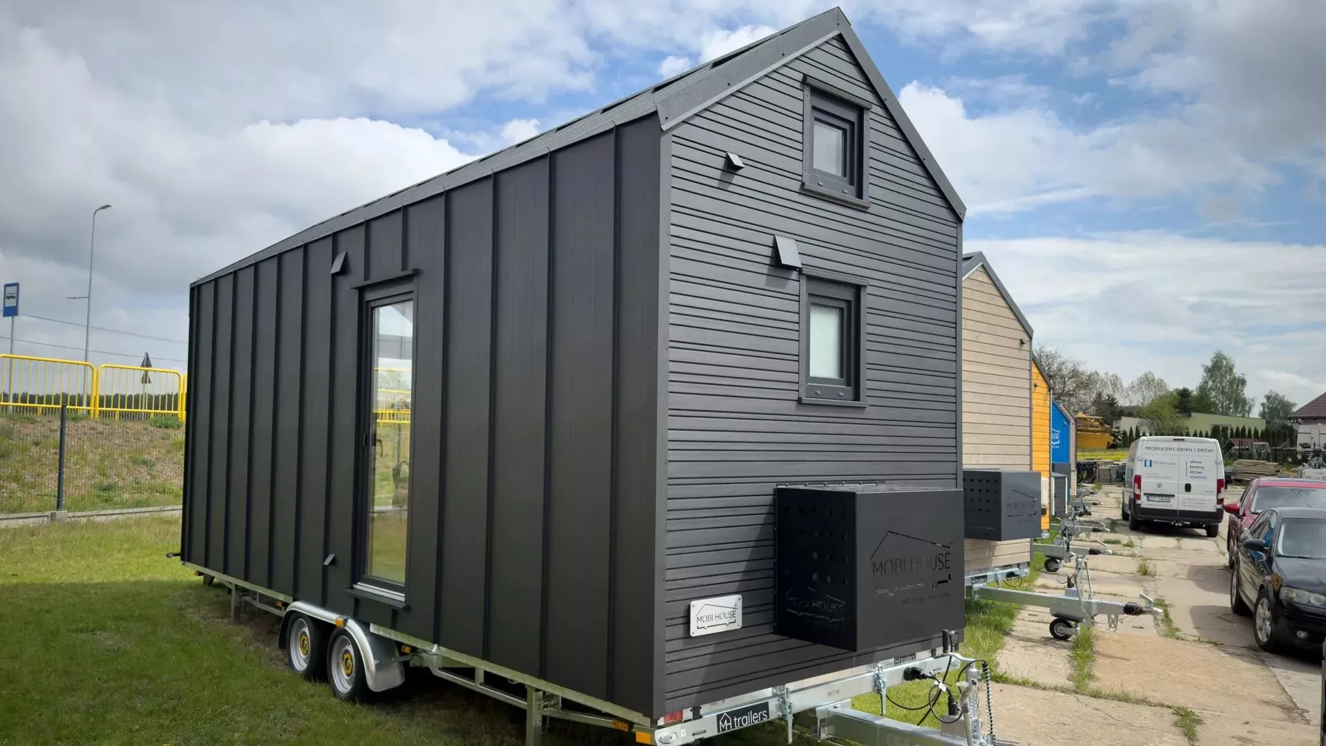 The dark chocolate exterior is made up of a combination of metal cladding and wood-look materials