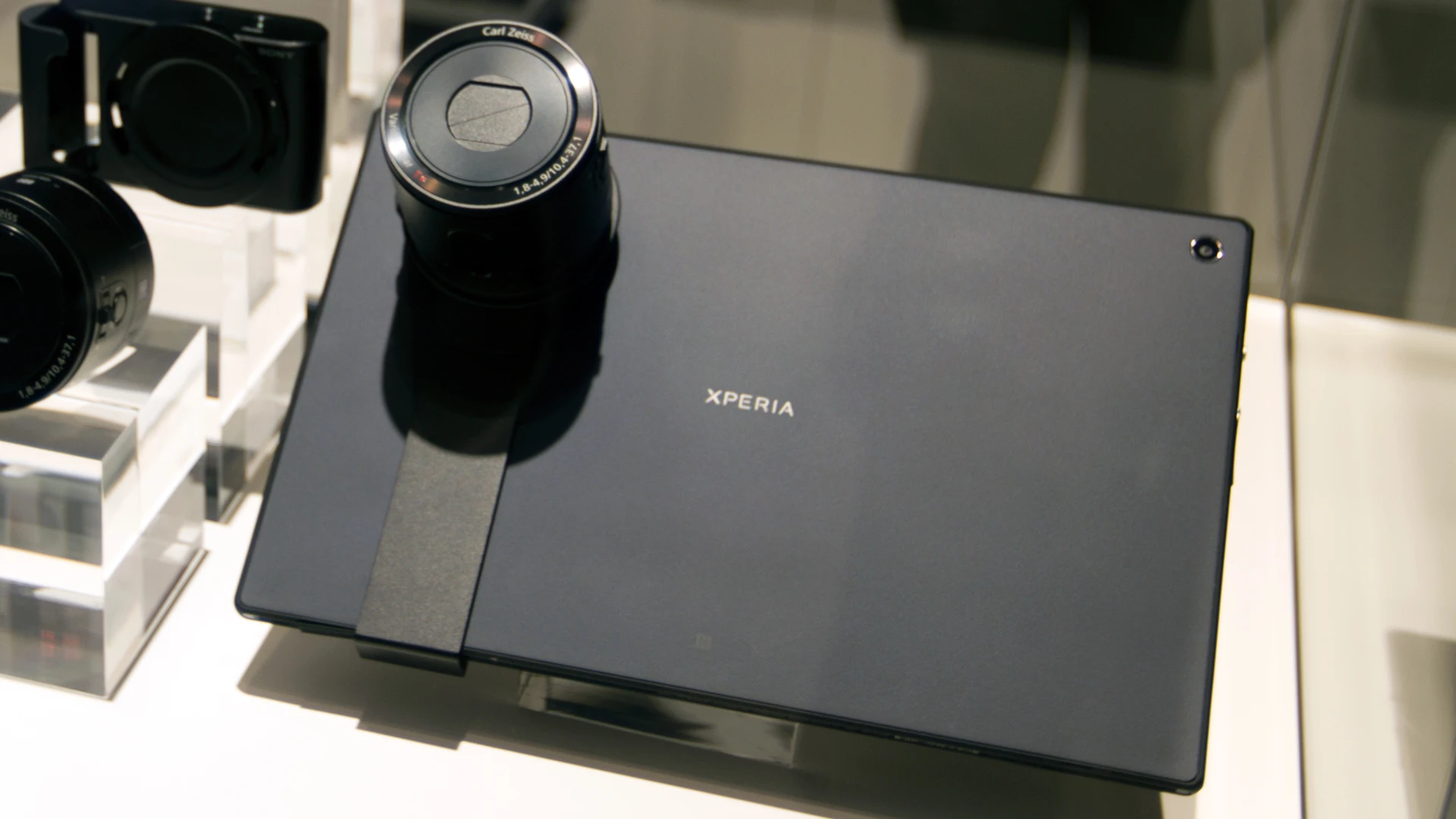 The QX cameras attach to a smartphone or tablet via different adapters