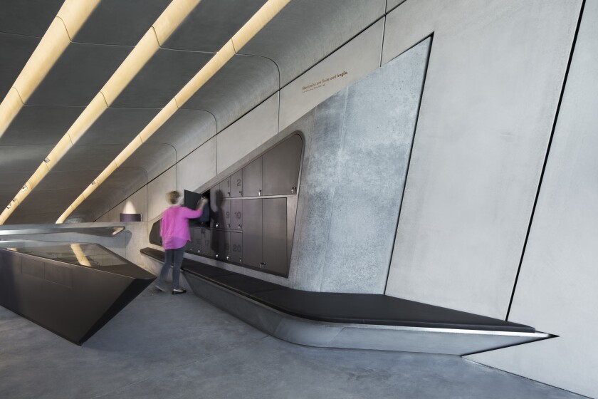 The interior is aptly likened to a grotto by Hadid herself, and results in a series of areas to explore