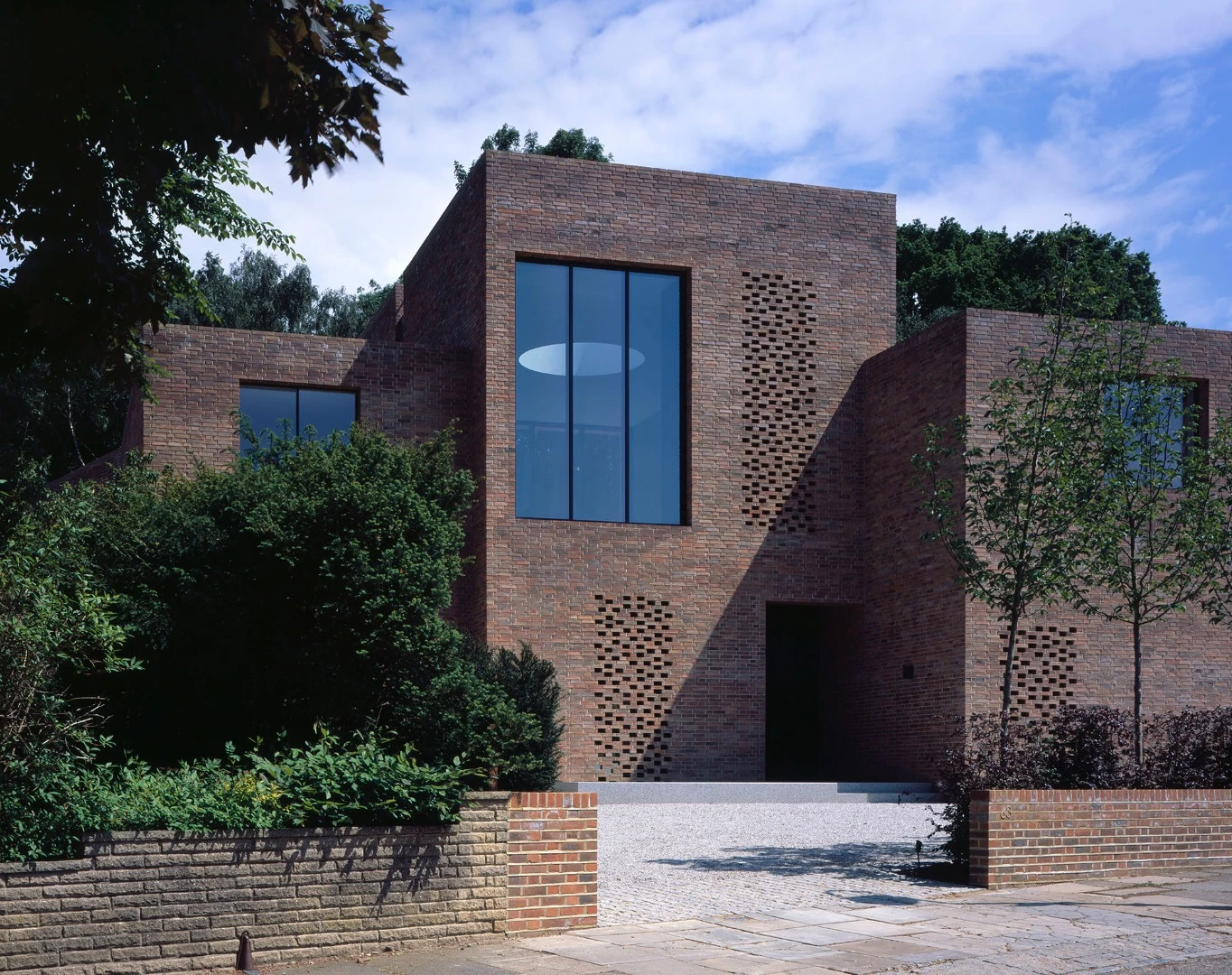 Highgate House replaced a large, detached Edwardian house, in a residential street on the edge of Highgate Woods, London