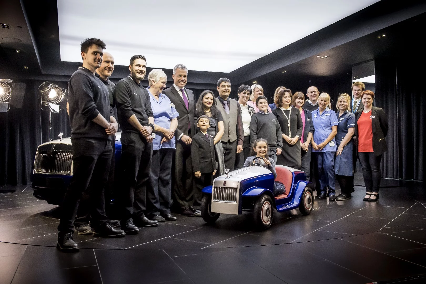 The team responsible for the Rolls-Royce SRH, alongside representatives from the Pediatric Unit at St Richard’s Hospital and the Matthews and Rajyaguru families