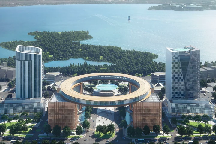 The Shanghai Lingang Special Area will be defined by a circular building named The Ring, which will be supported by four mixed-use towers