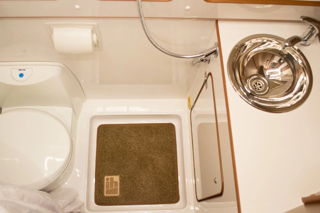 The bathroom is a little more spacious than the average wet cell