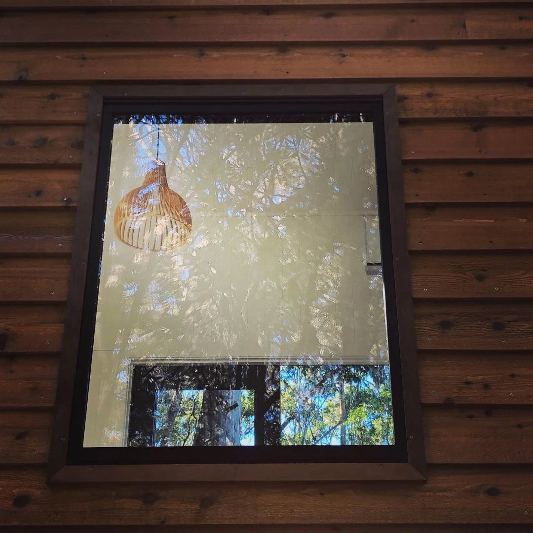 Another window sits above the quaint dining table