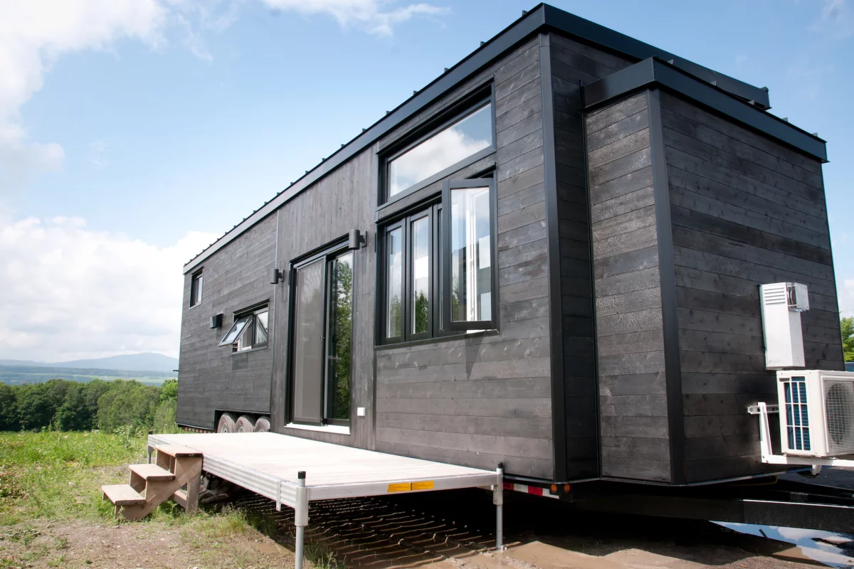 The Baobab tiny house is clad in wood that's been treated using the distinctive Japanese Shou Sugi Ban method of charring wood to preserve it