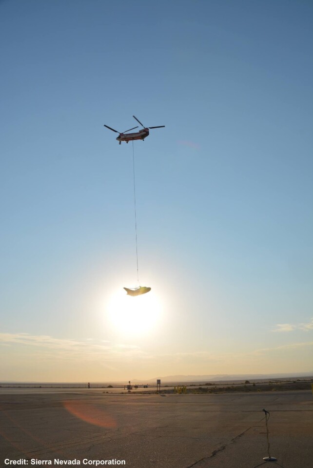 A Chinook helicopter hoisted the Dream Chaser into the air for this first captive-carry flight test