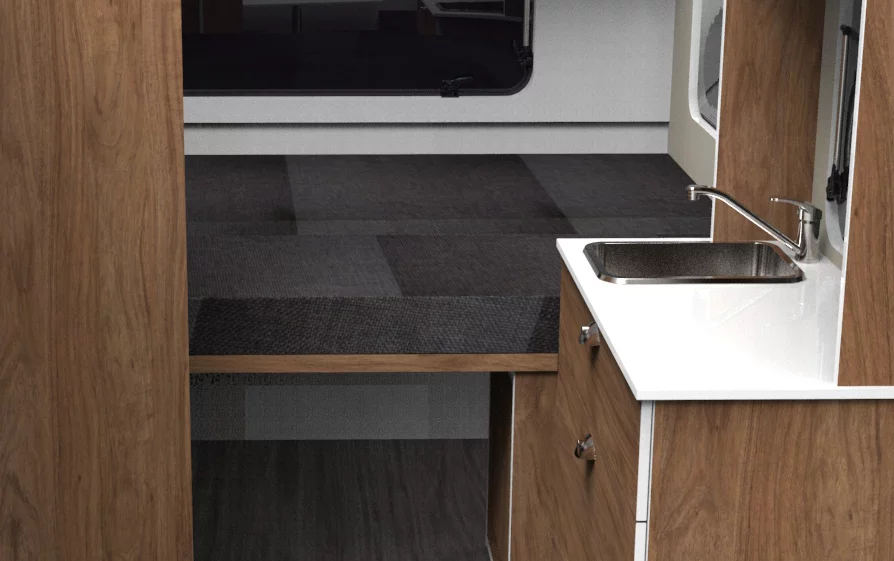 The Travelino has a double bed on one end, a dining set on the other