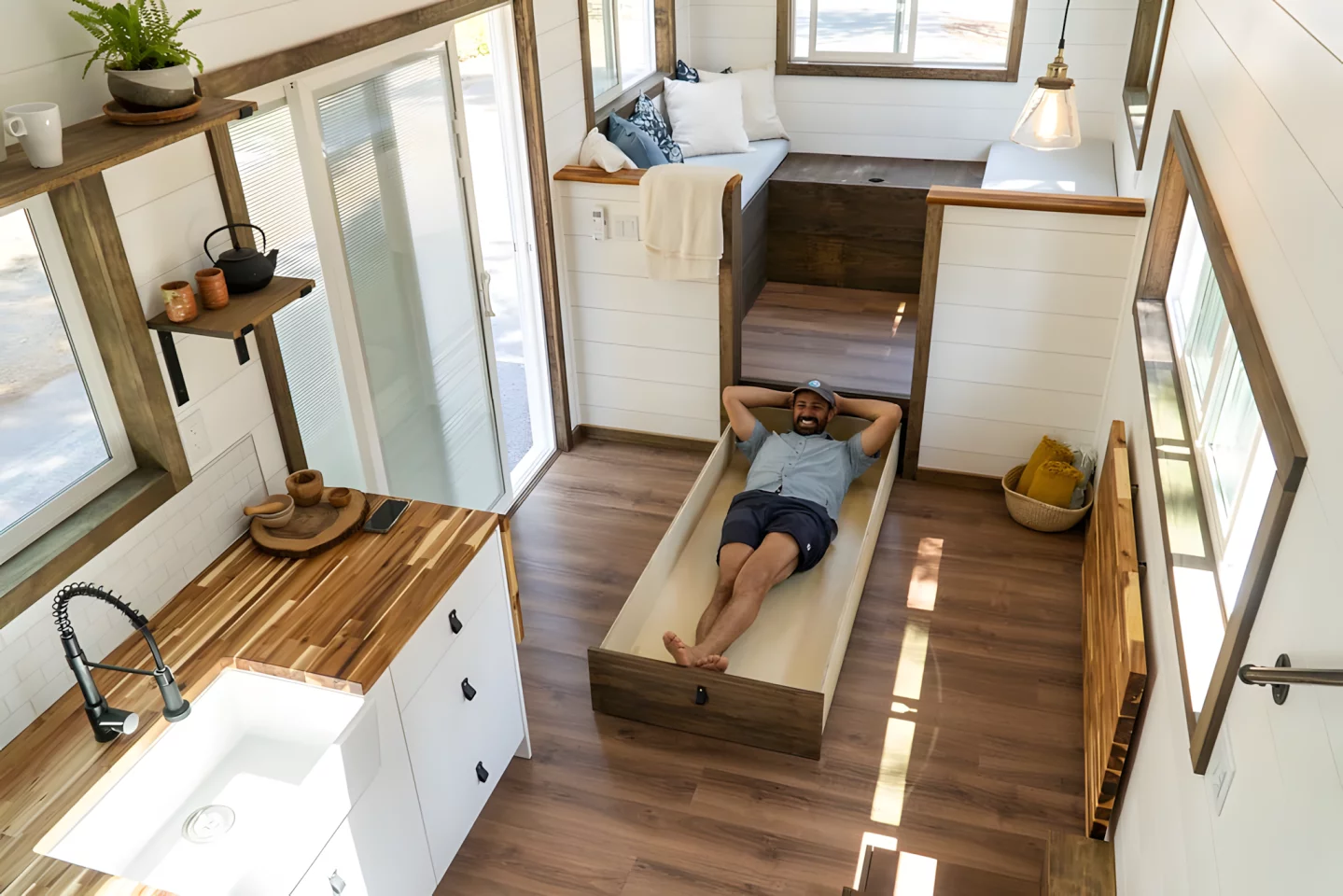 Thanks to its raised position, the Olympic's living room has lots of storage space available