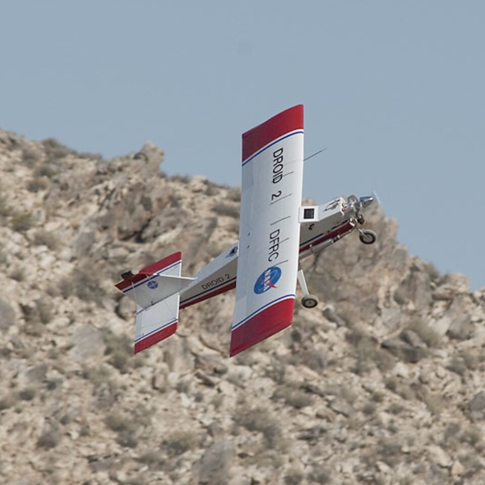 NASA's DROID drone banks sharply to avoid a desert ridge (Photo: NASA, Tom Tschida)