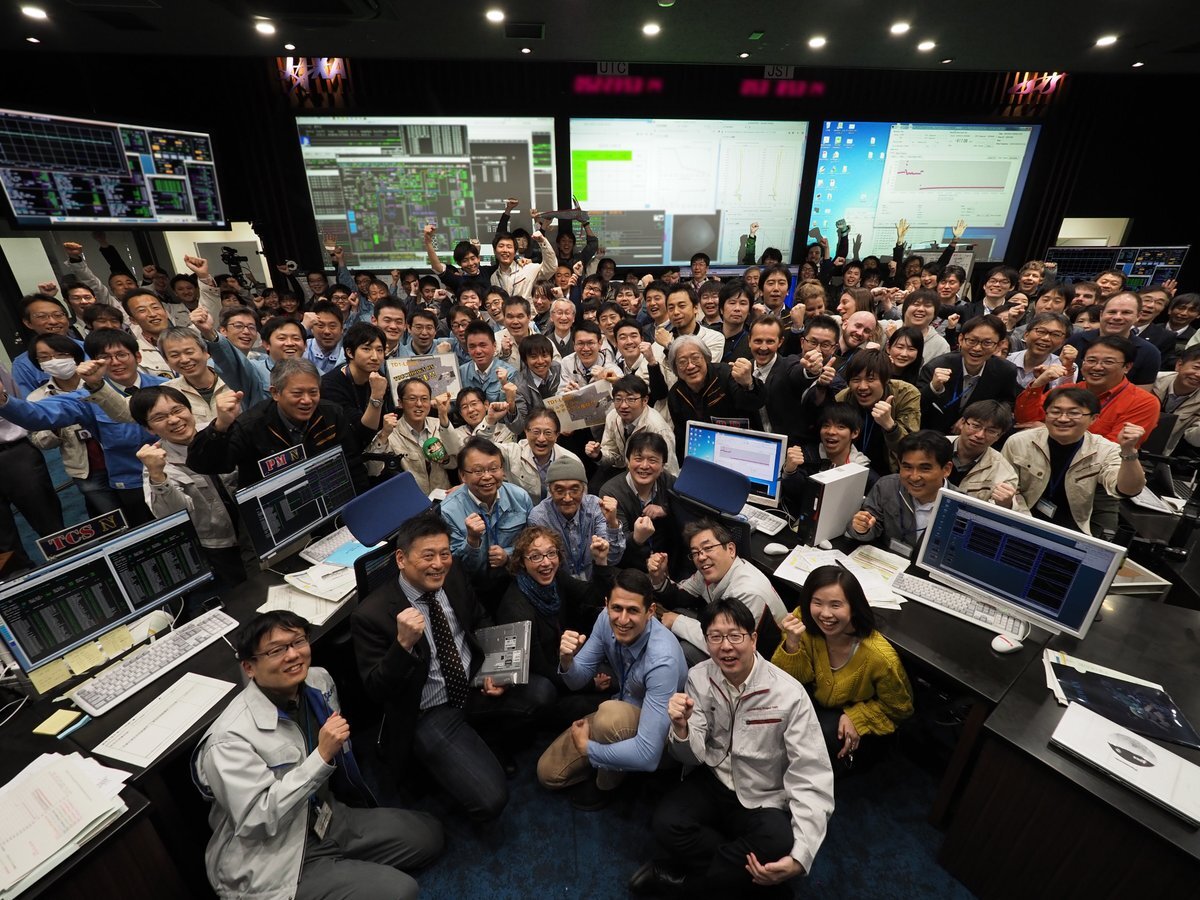 Mission scientists celebrate at JAXA following the successful touchdown of Hayabusa 2