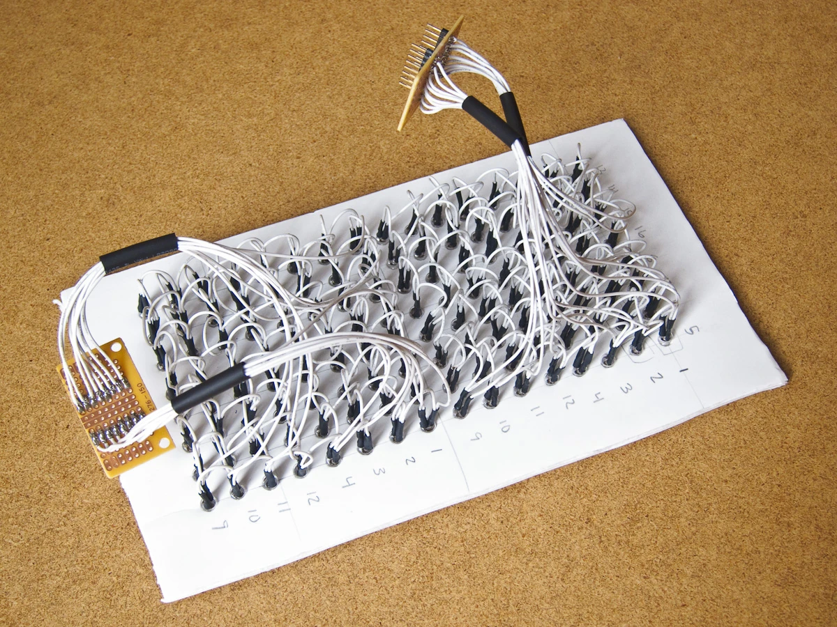 The game display is comprised of 128 LEDs, which were used to construct two 8x8 matrices