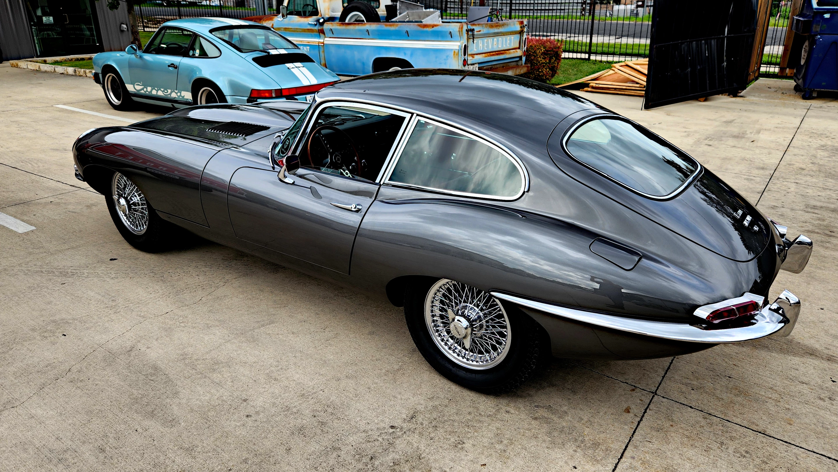 The E-Type, one of the author's favorite cars, is a beautiful showcase of classic restoration