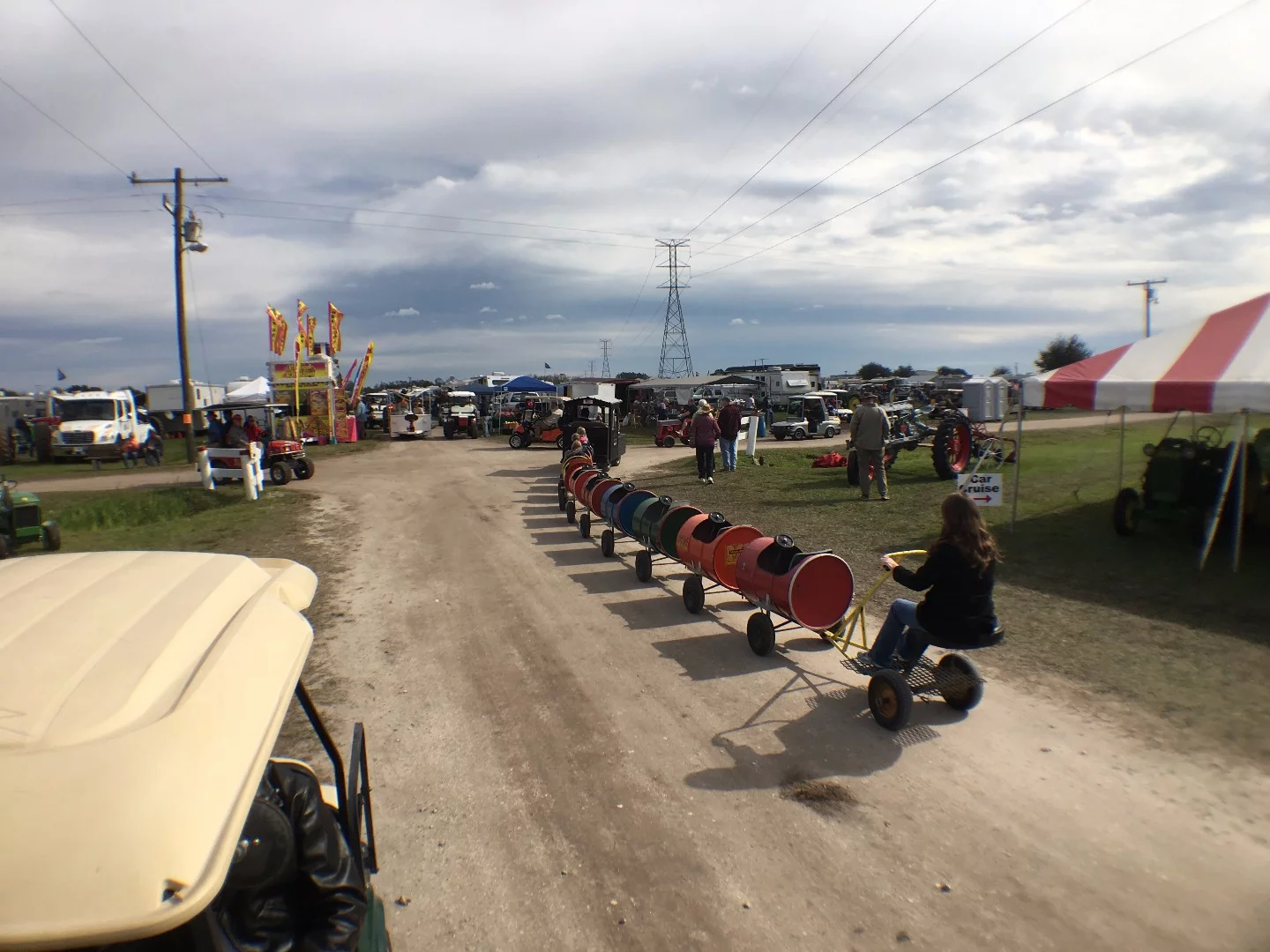 It's a bring the family event and this children's train ride made of barrels runs all around the 250 acre Florida Flywheelers property