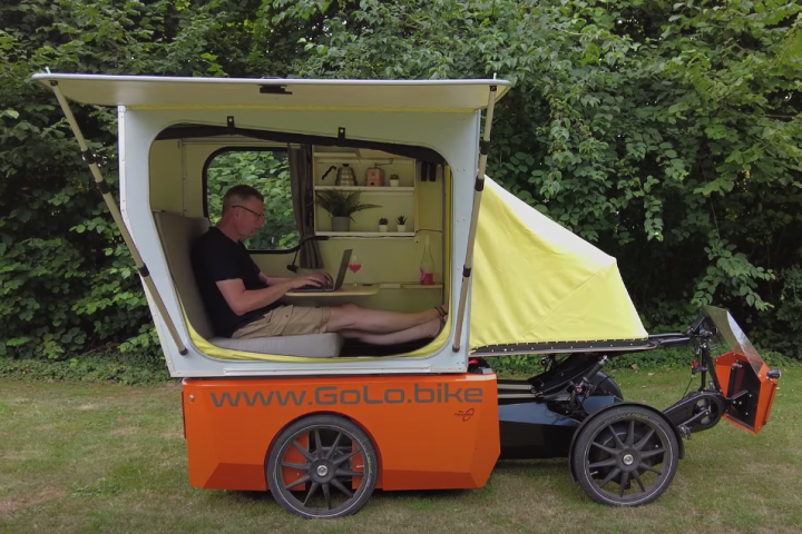 The GoCamp makes a cozy workspace, lounge and overnight shelter for its rider