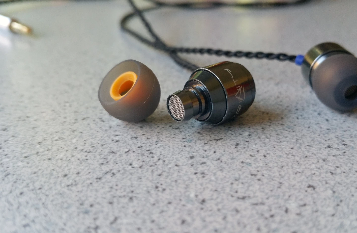 The Trinity Audio Delta IEMs gunmetal filters deliver a "smooth" audio experience