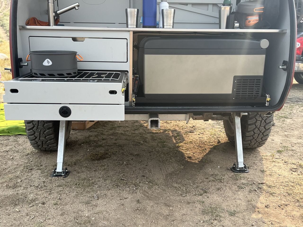 Escapod's design leaves a large space for the Yeti cooler or Arb fridge