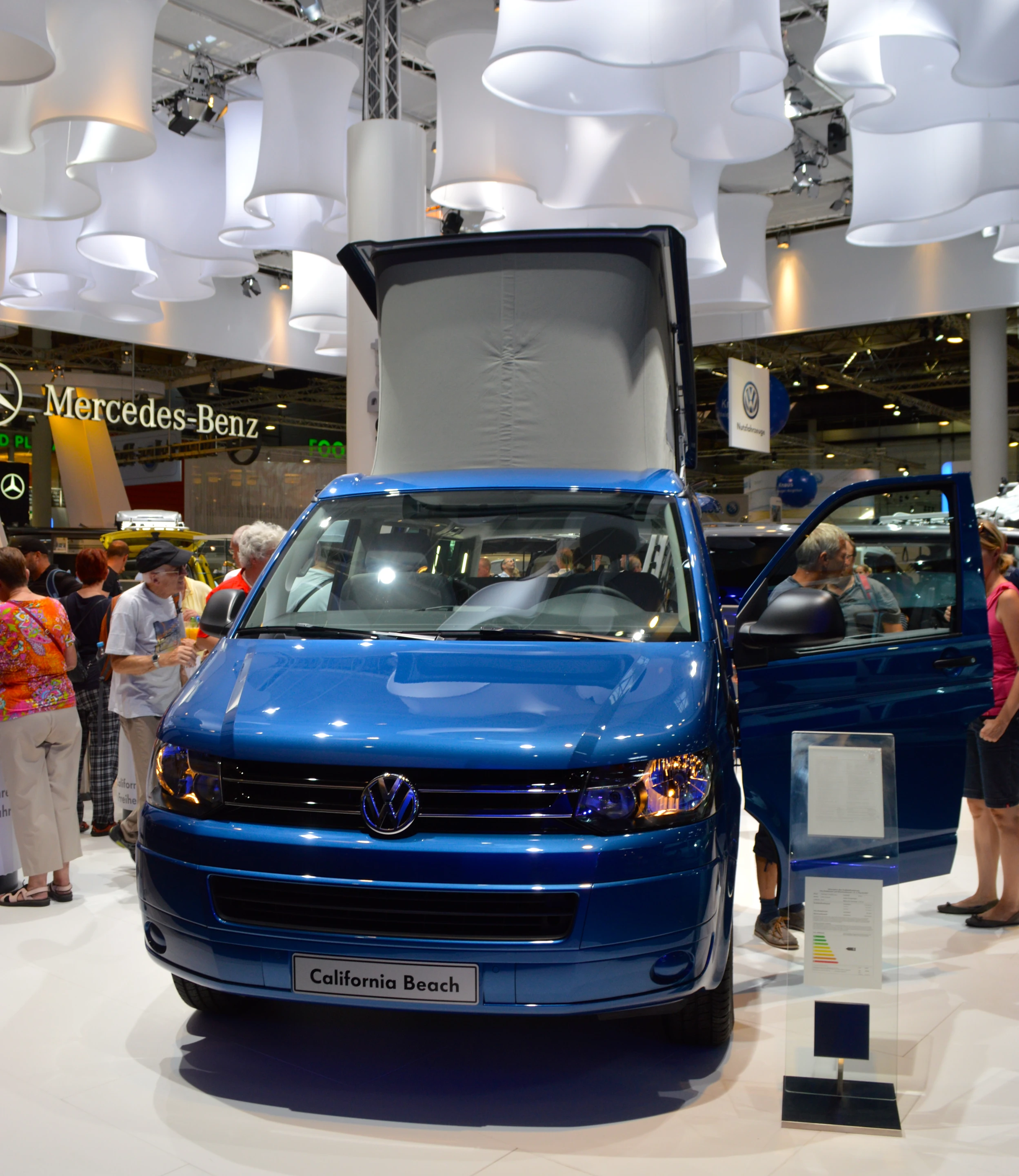 The VW California Beach painted in "Olympia Blue Metallic" has a manual pop-up roof