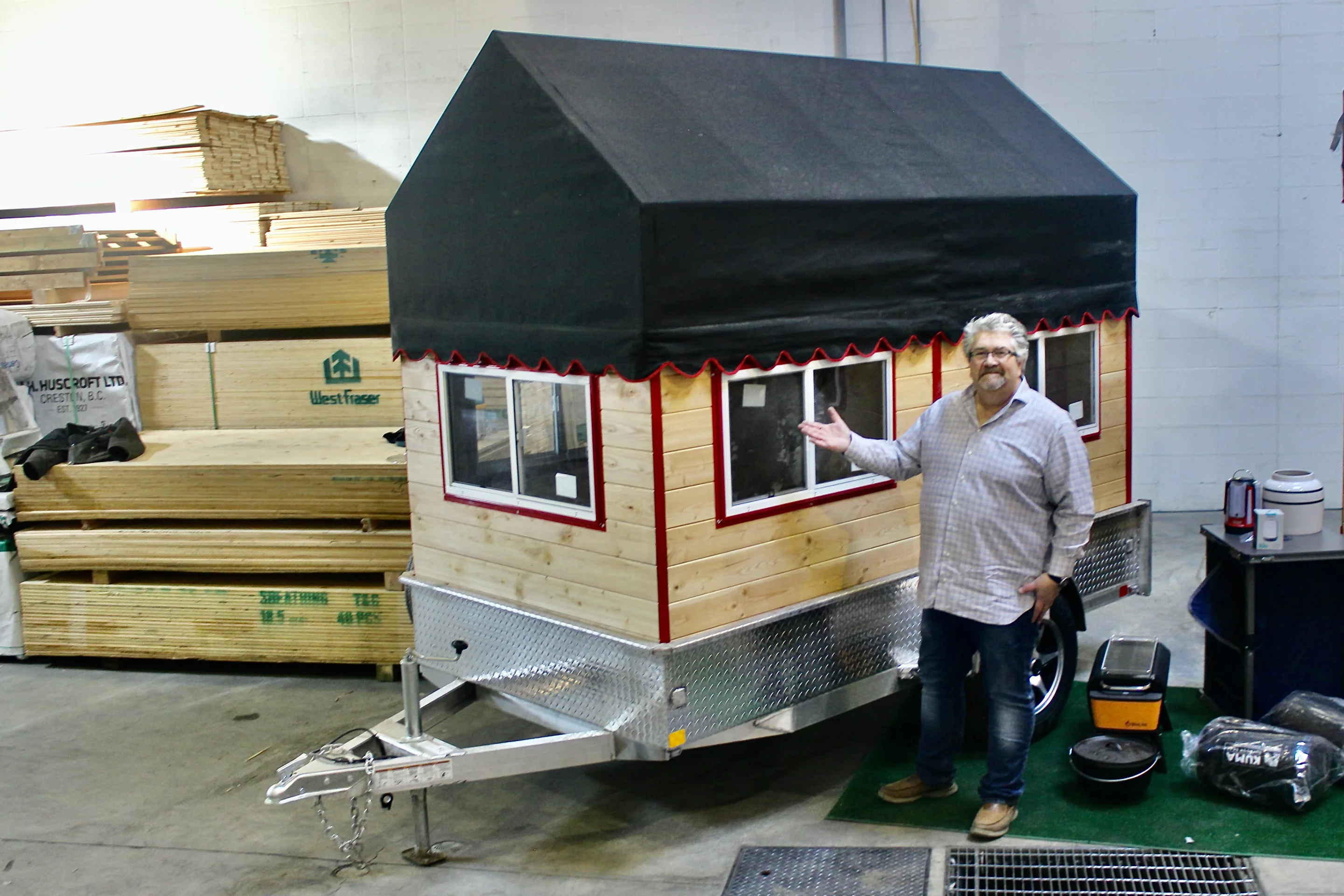 Knotty Pine Cabins president Andre Depelteau with his invention, the Glamper trailer