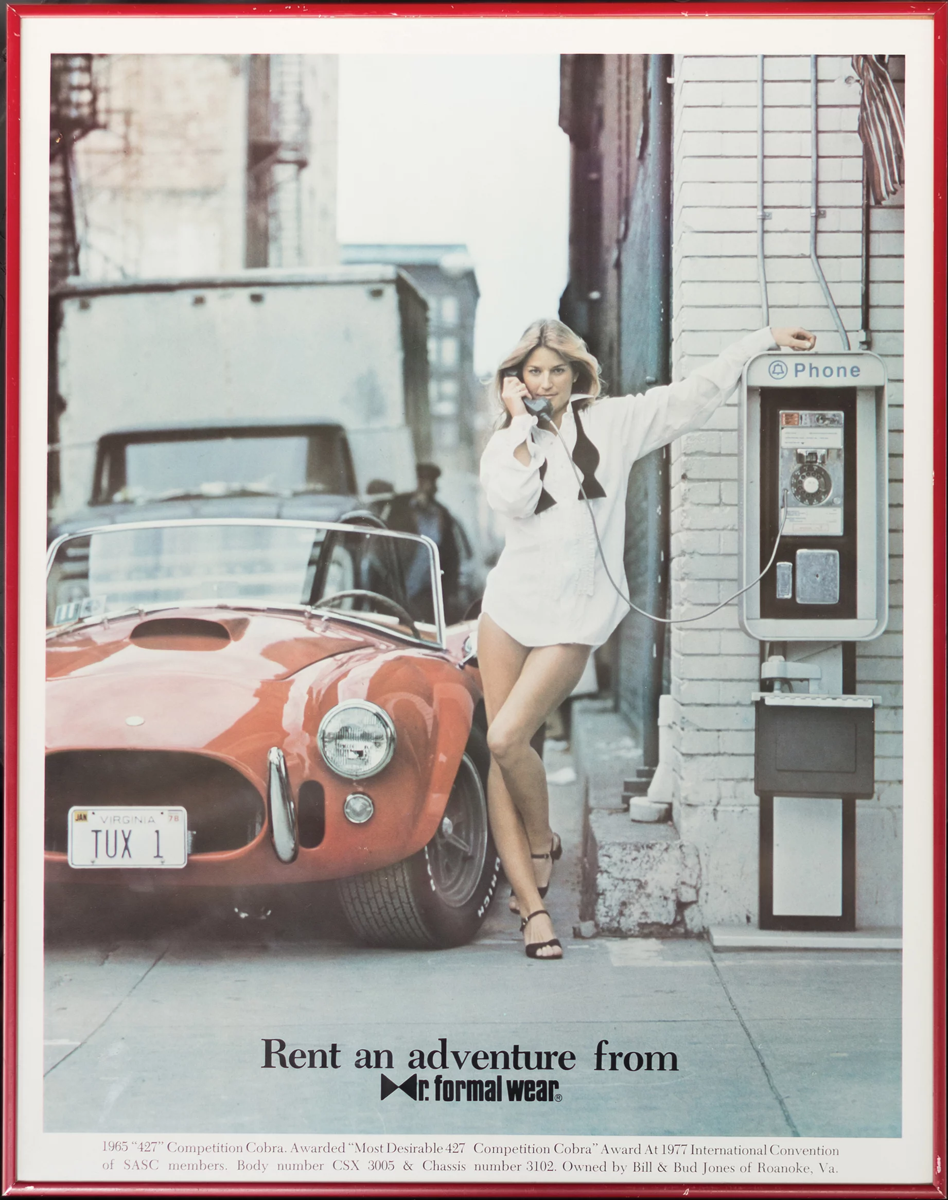 While much has been written about this Cobra, it is most famous for its appearances in promotional pieces for the menswear company, Mr. Formal Wear, the most famous of which depicts a buxom blonde, clad in white tuxedo shirt, bow tie, high heels, and nothing else, chatting on a payphone next to the Cobra before two astonished onlookers. Another piece, famously titled “Some Guys Have It Tough,” depicts the Cobra beachside, with its driver and his lovely passenger skinny-dipping in the distance. Those posters appeared on bedroom and workshop walls all over the country and became legend among Cobra enthusiasts. This is THAT car. It sold for $990,000.