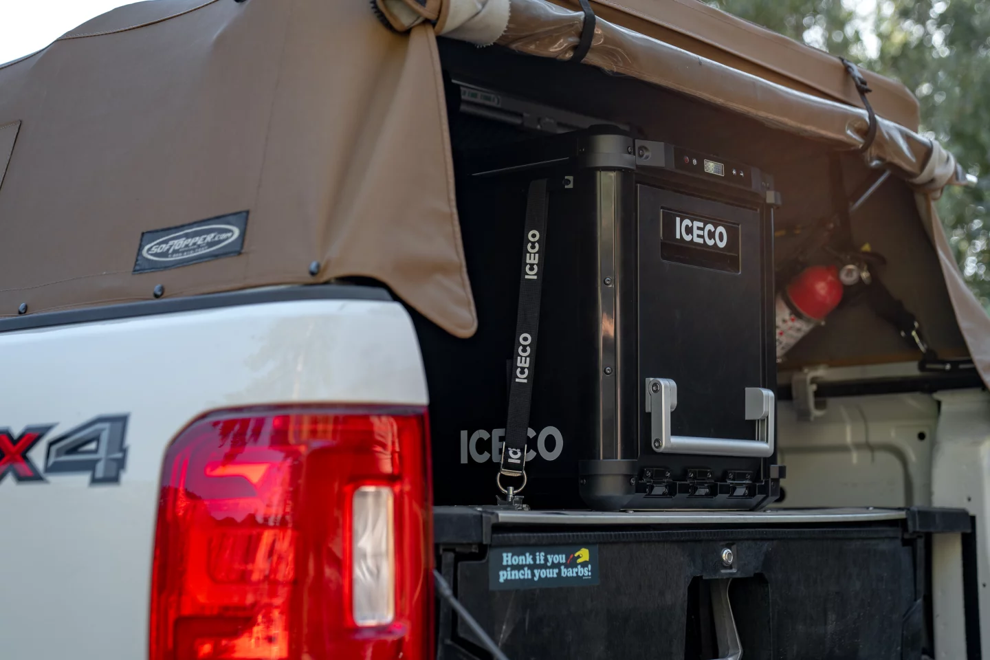 Given the fridge's heightened position atop the drawer system below, it doesn't look like the top lid will even open inside the canopy. With a typical fridge, you'd have to undo all those tie-downs and pull out the entire box. With the VL45 Plus, you merely have to open that front panel