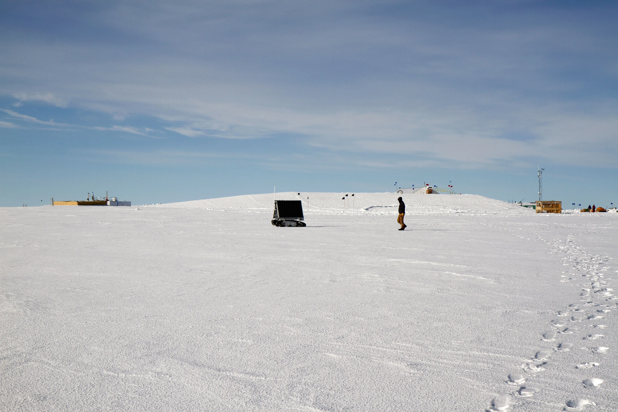 Mark Robertson follows behind GROVER while it is being controlled from Idaho by his advisor, Hans-Peter Marshall (Photo: NASA Goddard/Matt Radcliff)