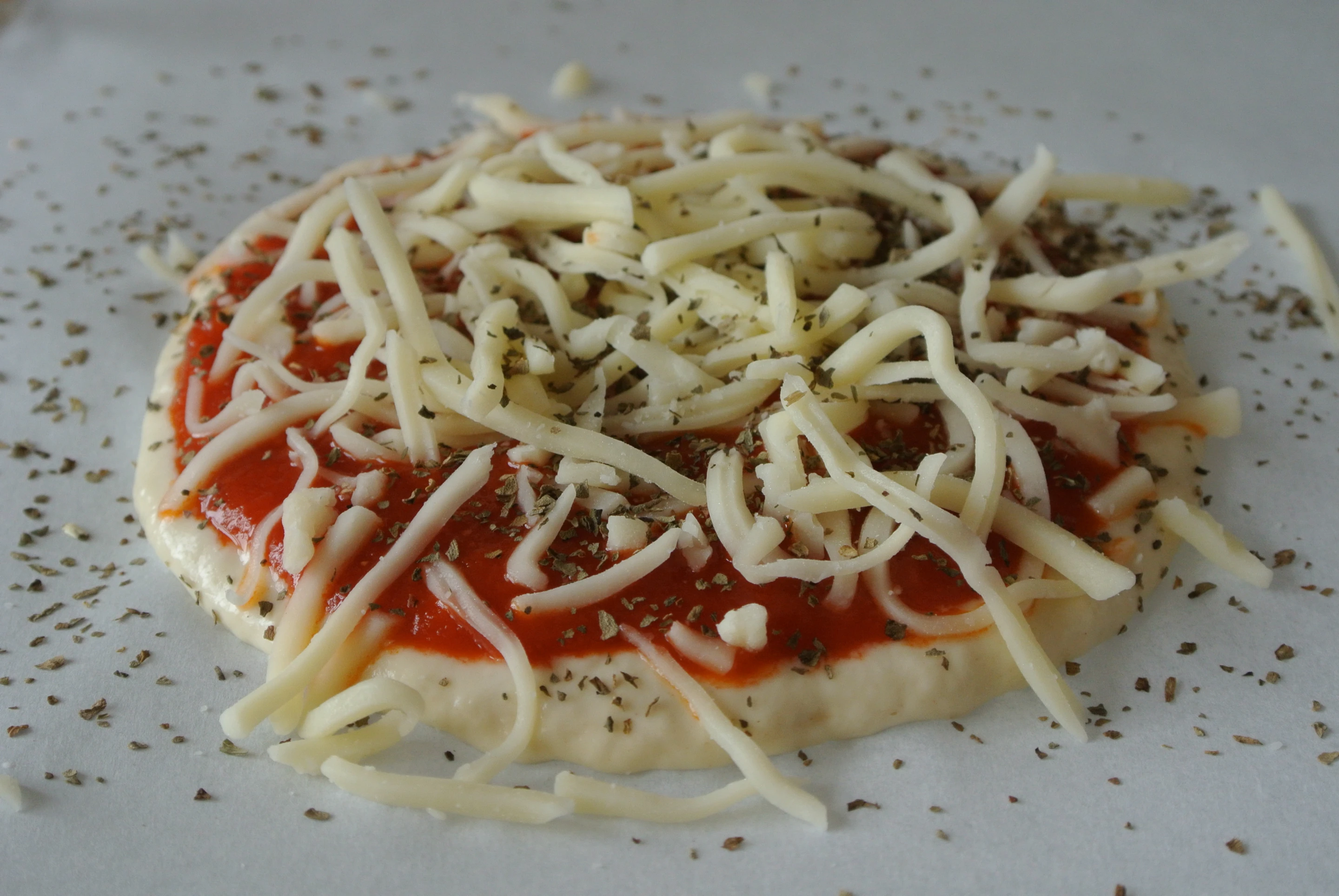 The Foodini user has to follow up with some steps, such as adding the cheese when the machine is done with the sauce