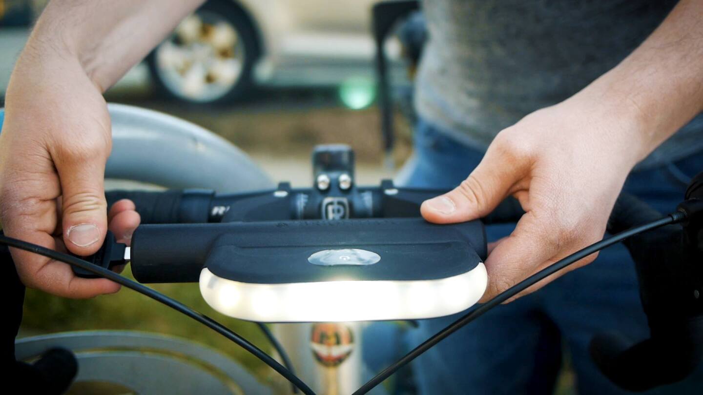 The BrightLoc's headlight module and cylinder are mounted on the handlebars