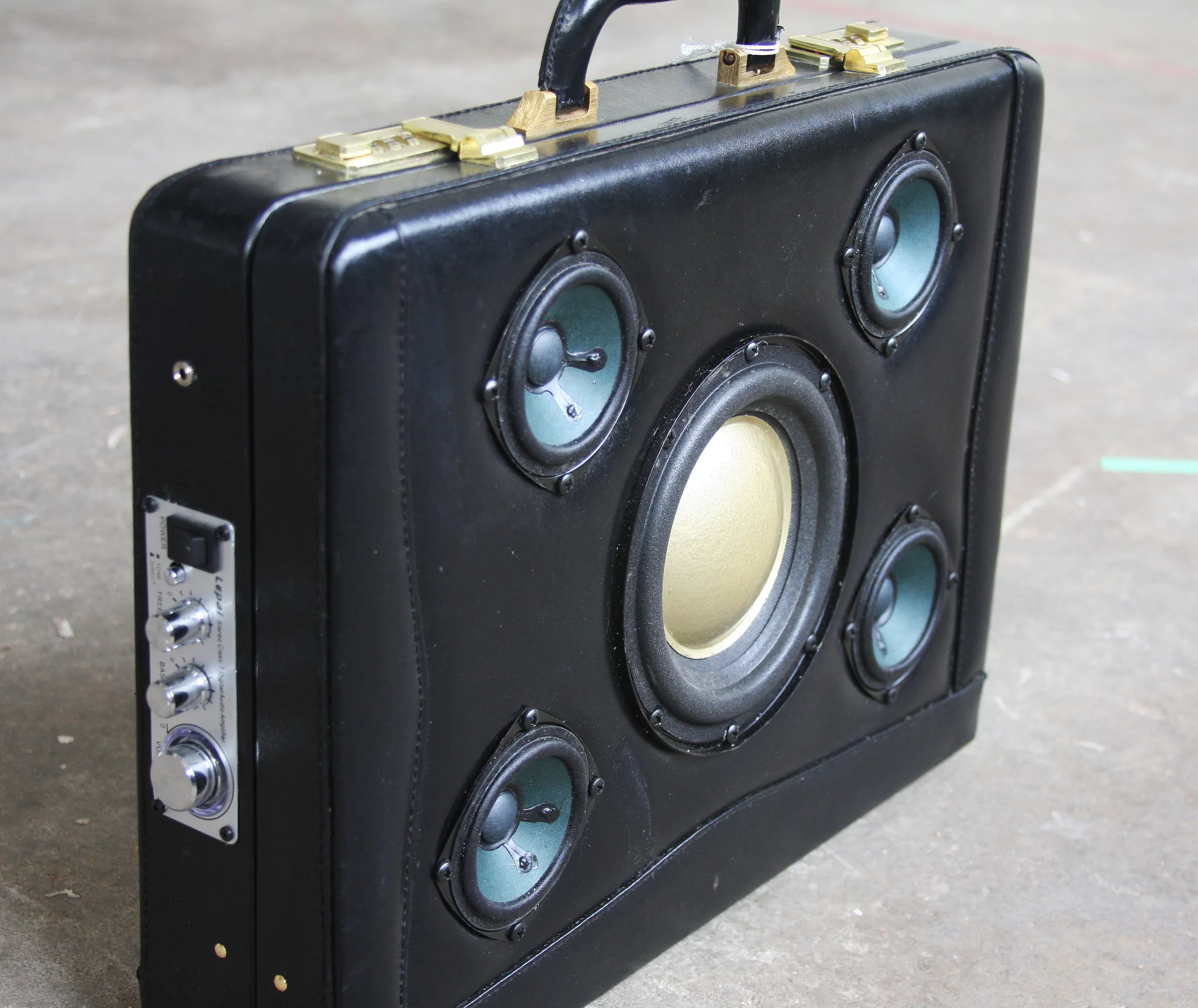 Jimbo holds a 50 W amp with tone controls and an illuminated volumes control