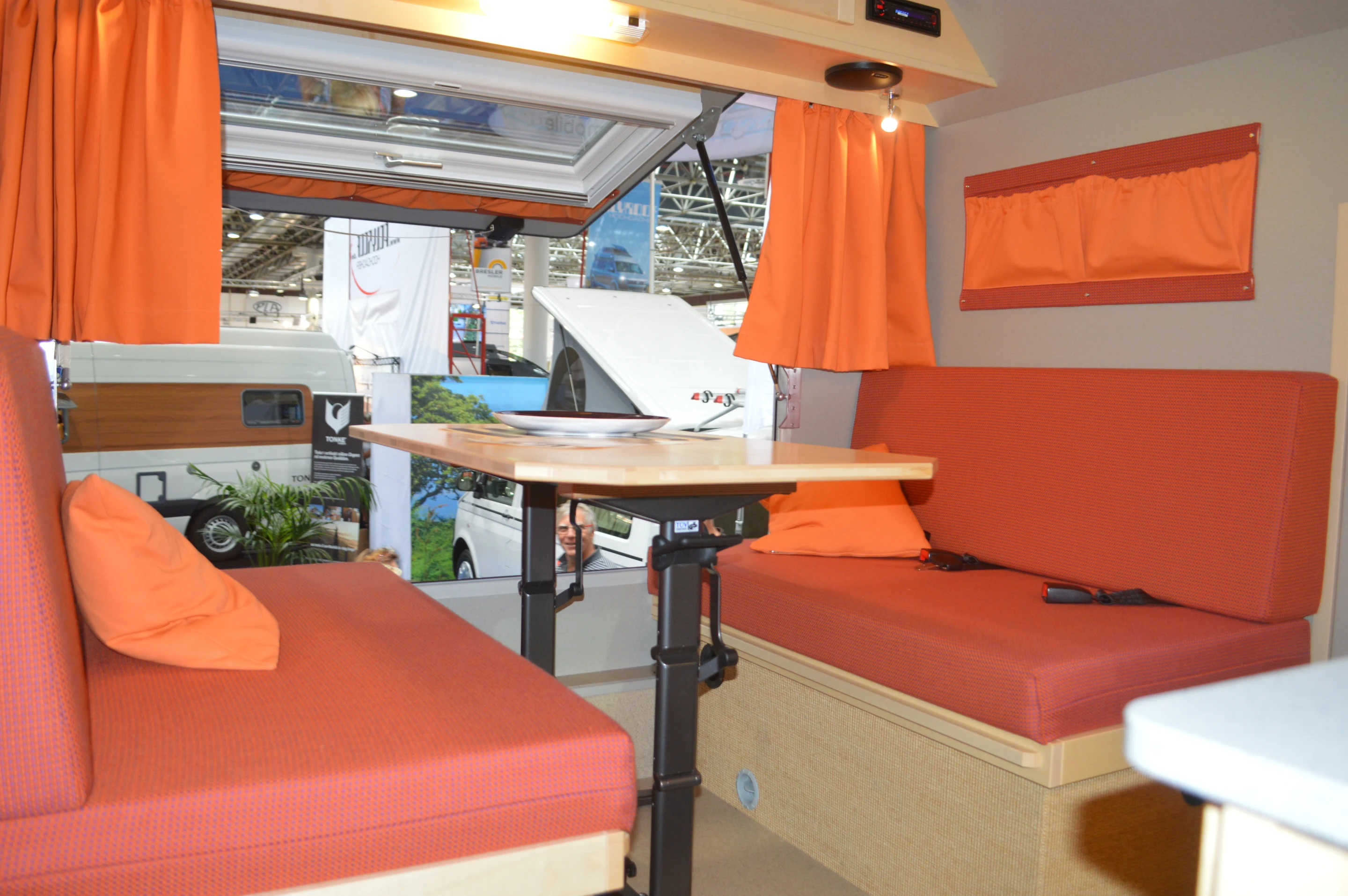 The dining table can lower to form a double bed
