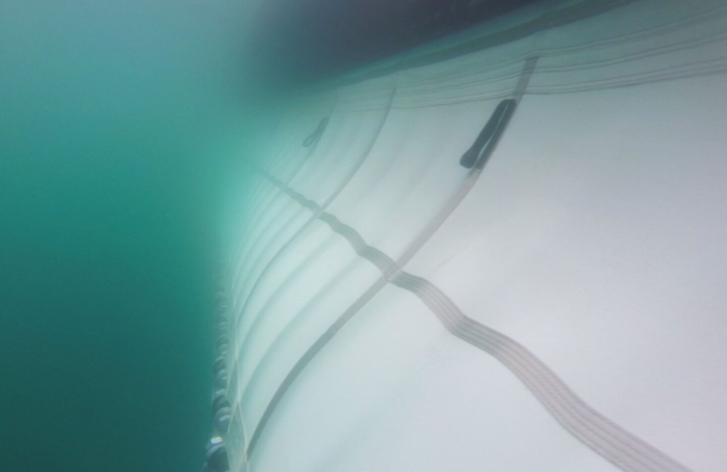 The hanging screen of The Ocean Cleanup Project's trash-collection barrier