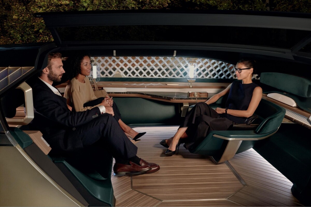 The EZ-Ultimo interior is a little odd in that it promotes third-wheel groups like this one. Seems like it would make more sense as a four-seater, but we guess that might interfere with the sliding "welcome" seat